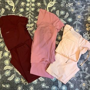 3 pairs of Jaanuu Scrubs.